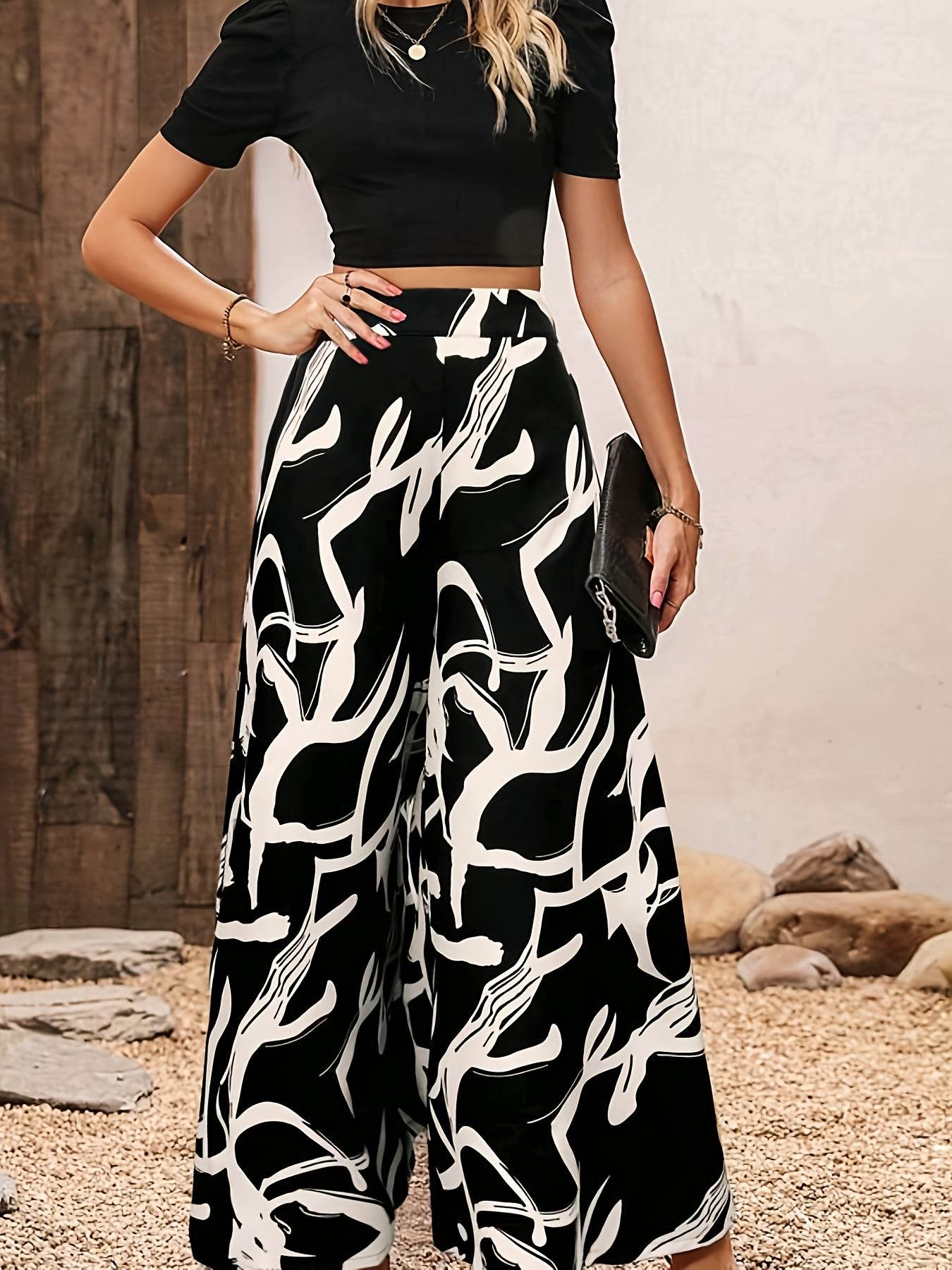 Elegant Women’s 2-Piece Set: Black Knit Top & Leaf Print Pants - Buy Center