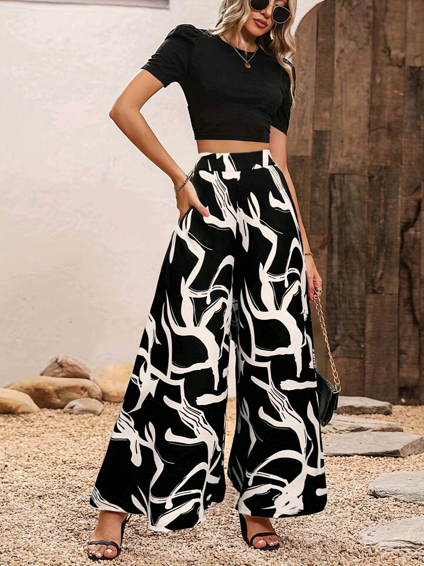 Elegant Women’s 2-Piece Set: Black Knit Top & Leaf Print Pants - Buy Center