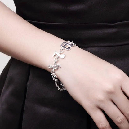 Exquisite Silver Music Note Bracelet - Elegant Jewelry for Music Lovers - Buy Center