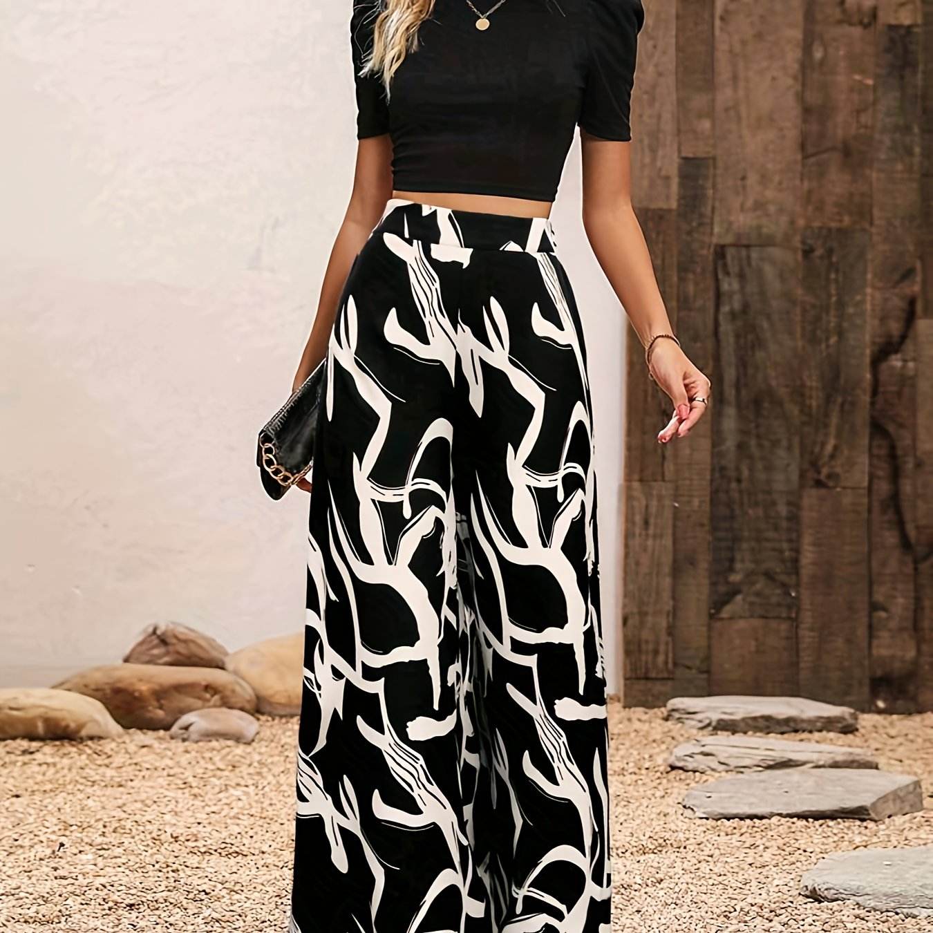 Elegant Women’s 2-Piece Set: Black Knit Top & Leaf Print Pants - Buy Center