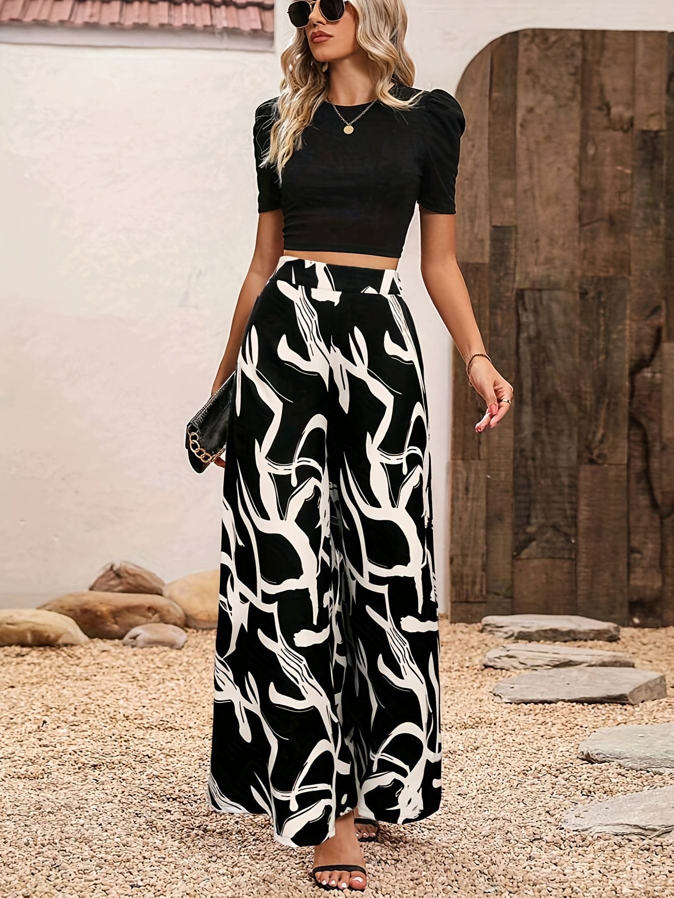 Elegant Women’s 2-Piece Set: Black Knit Top & Leaf Print Pants - Buy Center