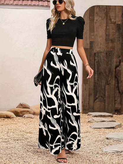 Elegant Women’s 2-Piece Set: Black Knit Top & Leaf Print Pants - Buy Center