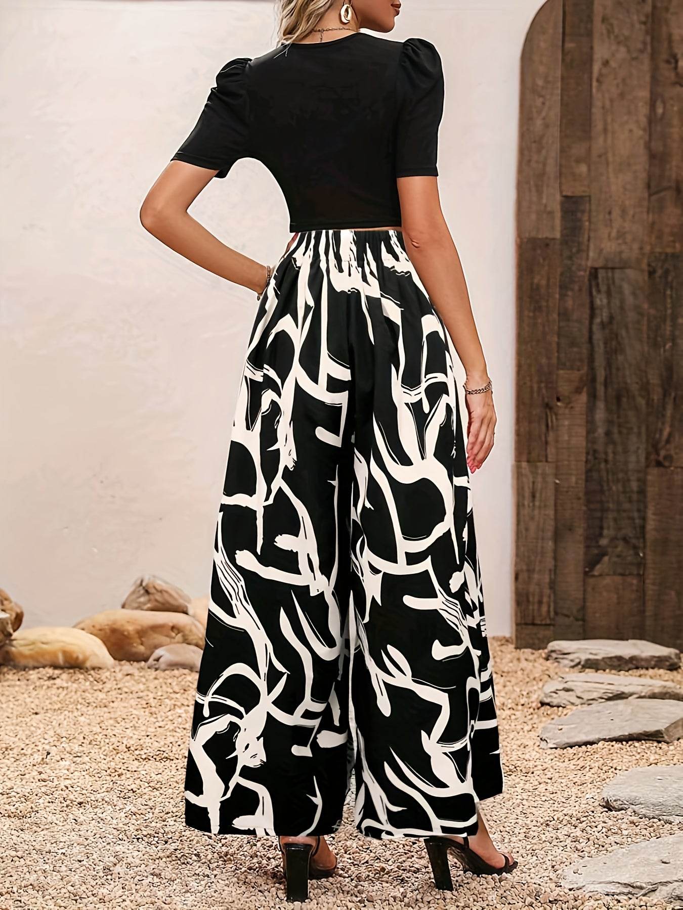 Elegant Women’s 2-Piece Set: Black Knit Top & Leaf Print Pants - Buy Center