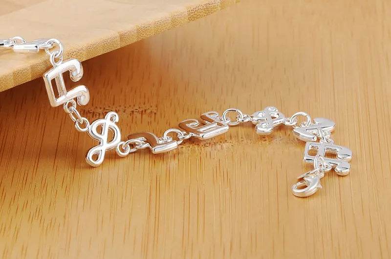 Exquisite Silver Music Note Bracelet - Elegant Jewelry for Music Lovers - Buy Center