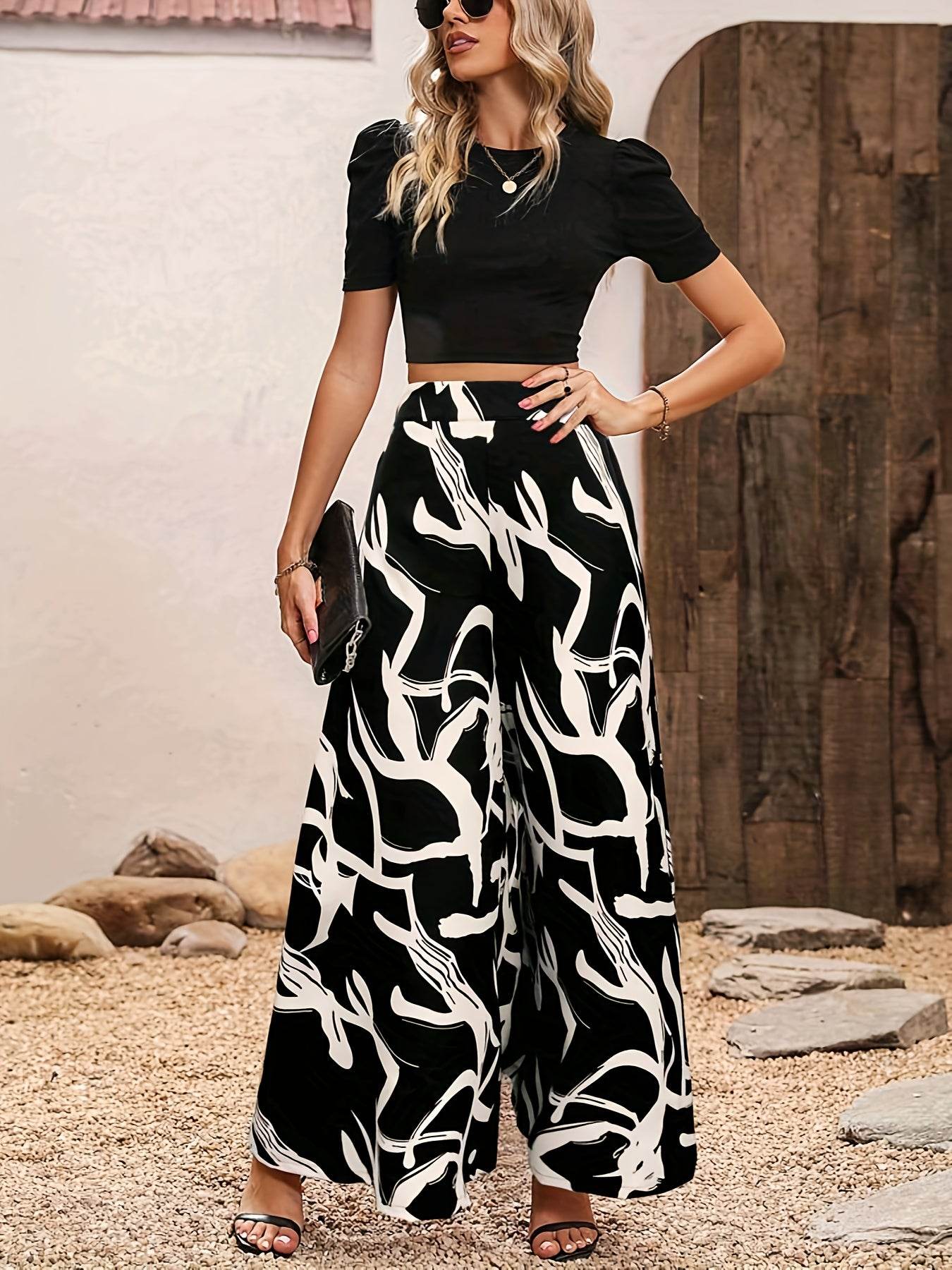 Elegant Women’s 2-Piece Set: Black Knit Top & Leaf Print Pants - Buy Center