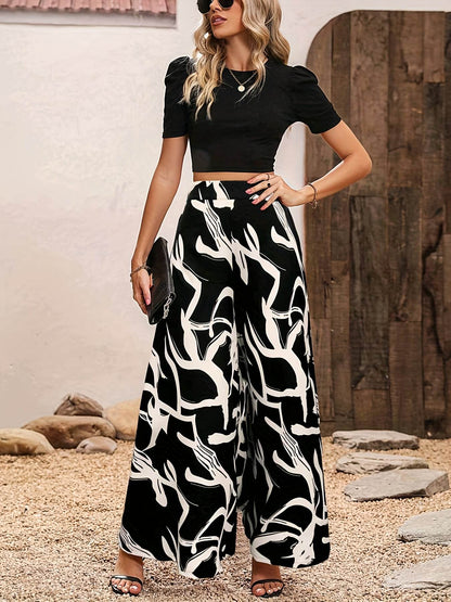 Elegant Women’s 2-Piece Set: Black Knit Top & Leaf Print Pants - Buy Center