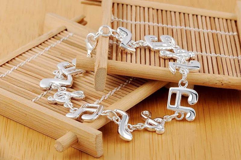 Exquisite Silver Music Note Bracelet - Elegant Jewelry for Music Lovers - Buy Center